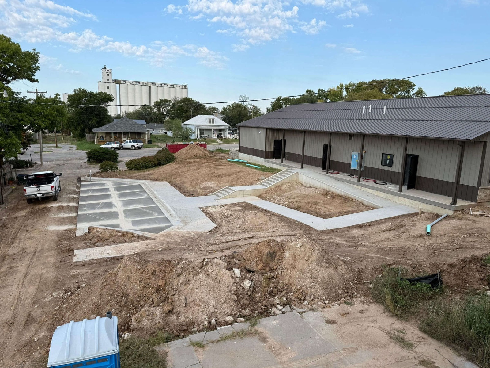 Concrete steps, ramp, and flatwork at a building