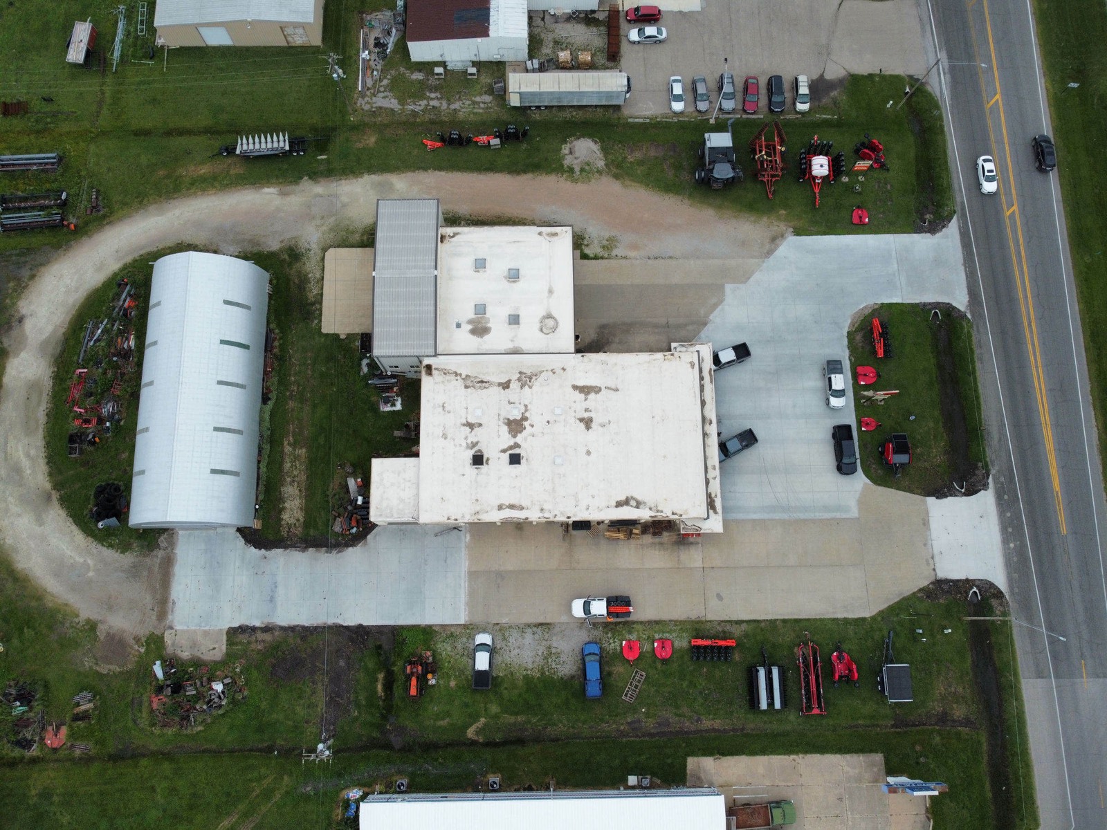 Aerial view of a commercial concrete lot and approach